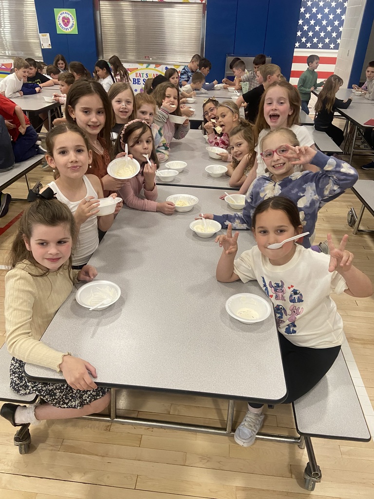 Students at an ice cream social in the cafeteria 