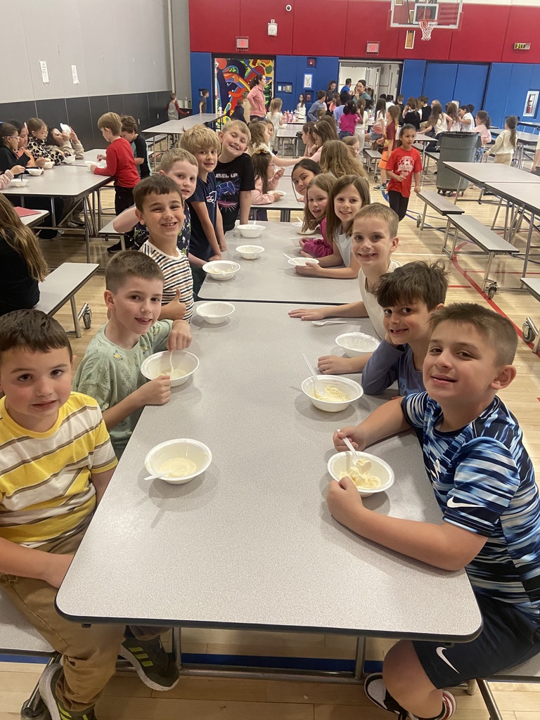 Students at an ice cream social in the cafeteria 