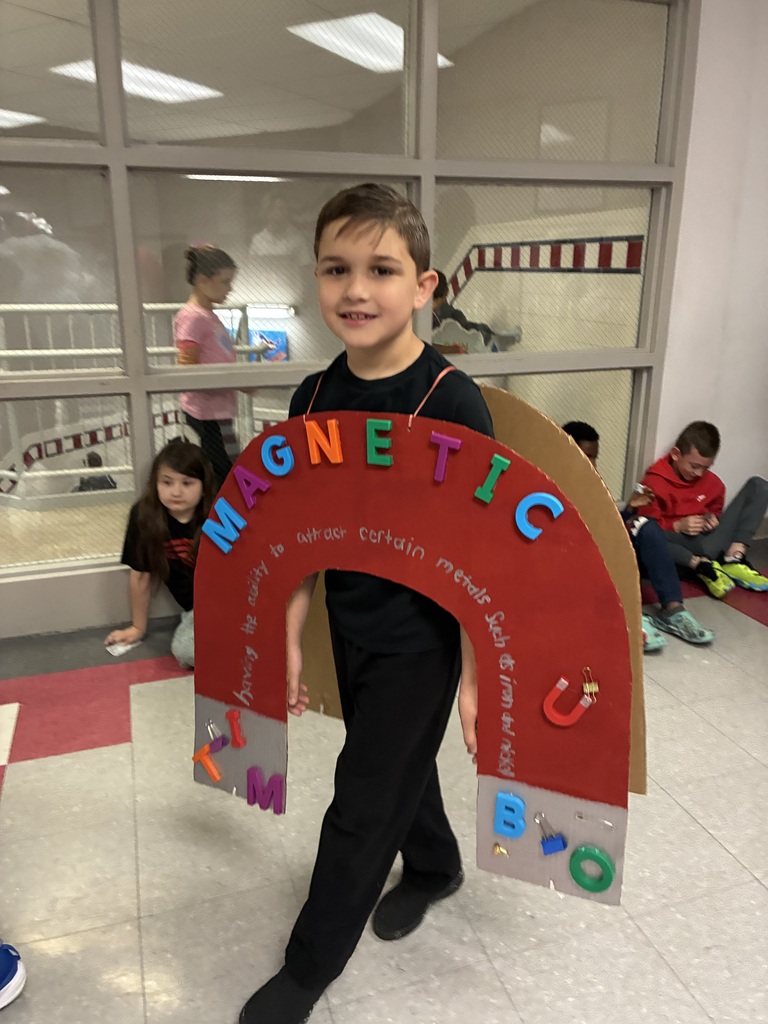 Students with vocabulary words jand dressed to illustrate the word . 