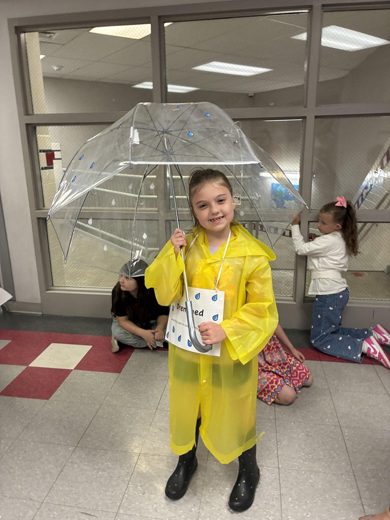 Students with vocabulary words jand dressed to illustrate the word . 