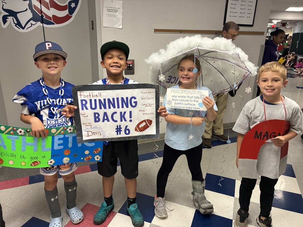 Students with vocabulary words jand dressed to illustrate the word . 