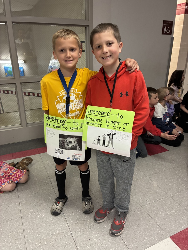 Students with vocabulary words jand dressed to illustrate the word . 