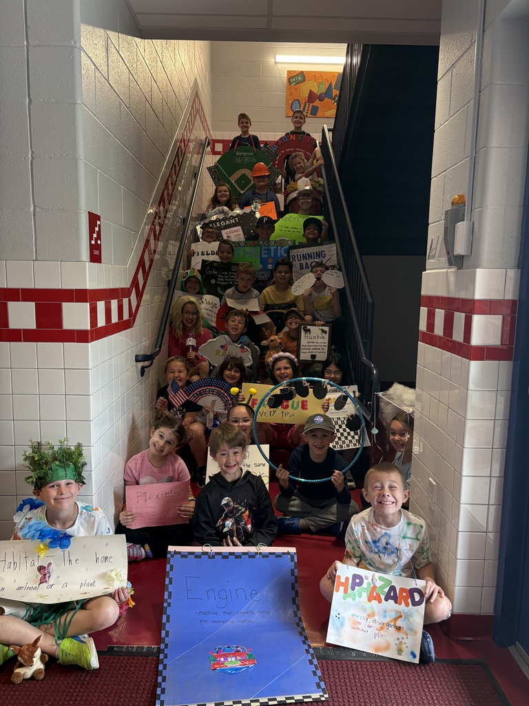 Students with vocabulary words jand dressed to illustrate the word . 