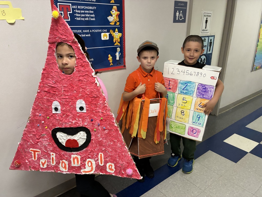 Students with vocabulary words jand dressed to illustrate the word . 