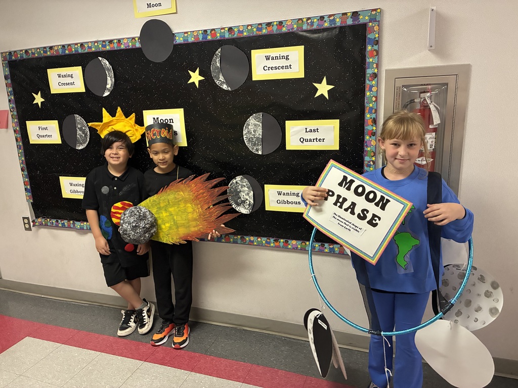 Students with vocabulary words jand dressed to illustrate the word . 
