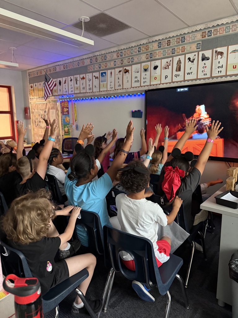 Students seated with a virtual roller coaster