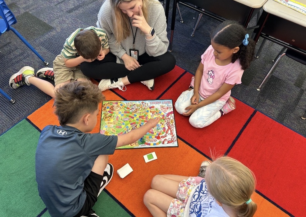 Kindergarten students playing board games 