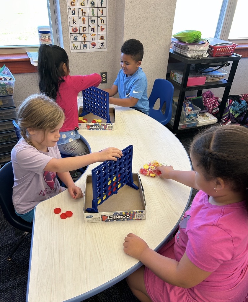 Kindergarten students playing board games 