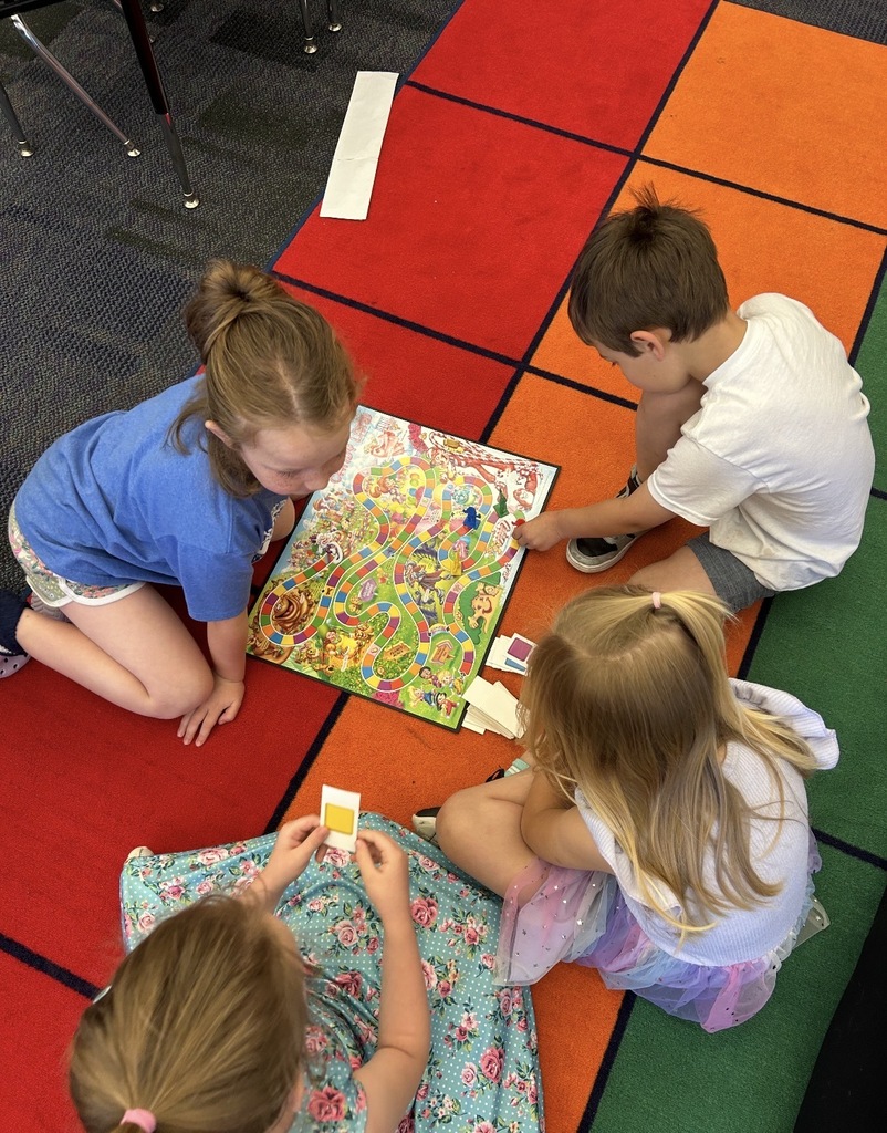 Kindergarten students playing board games 
