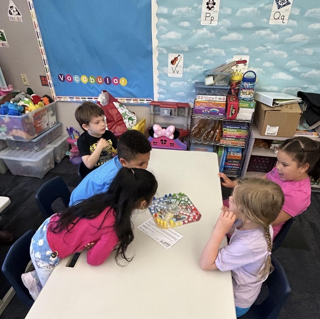 Kindergarten students playing board games 
