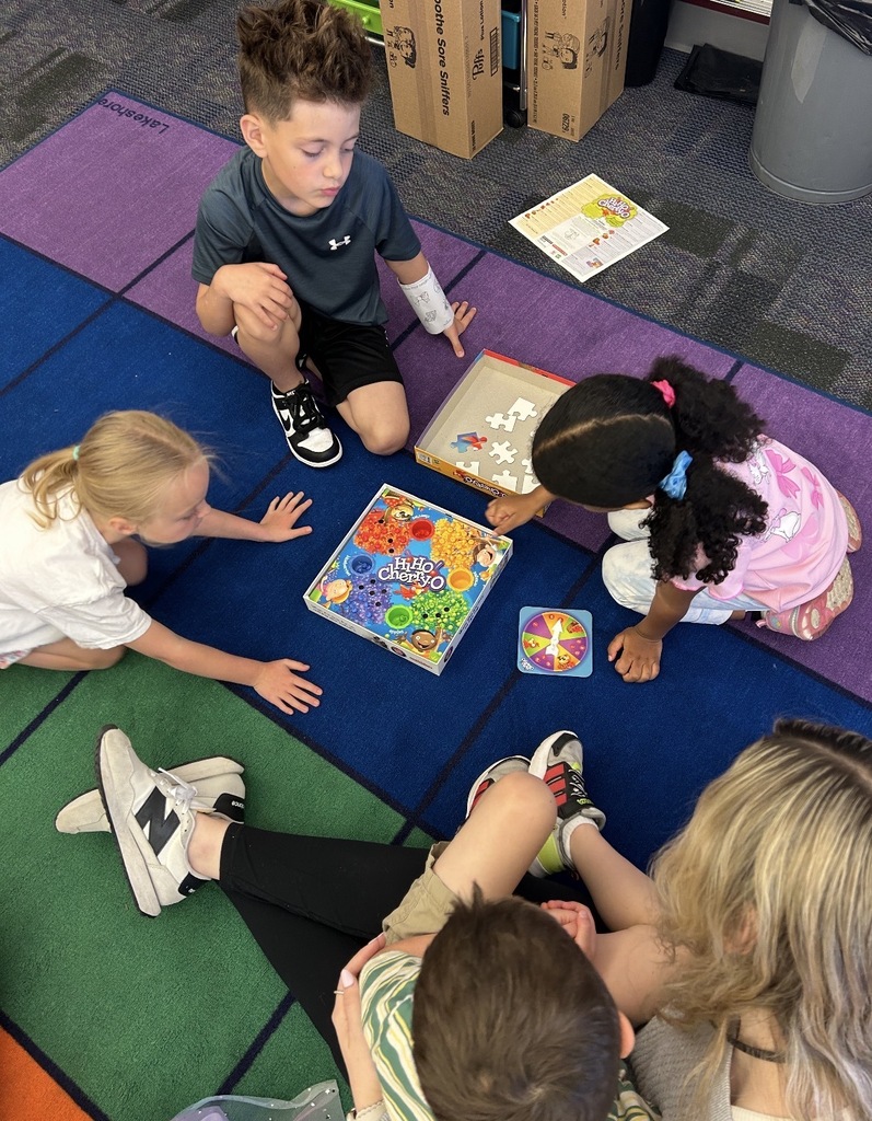 Kindergarten students playing board games 
