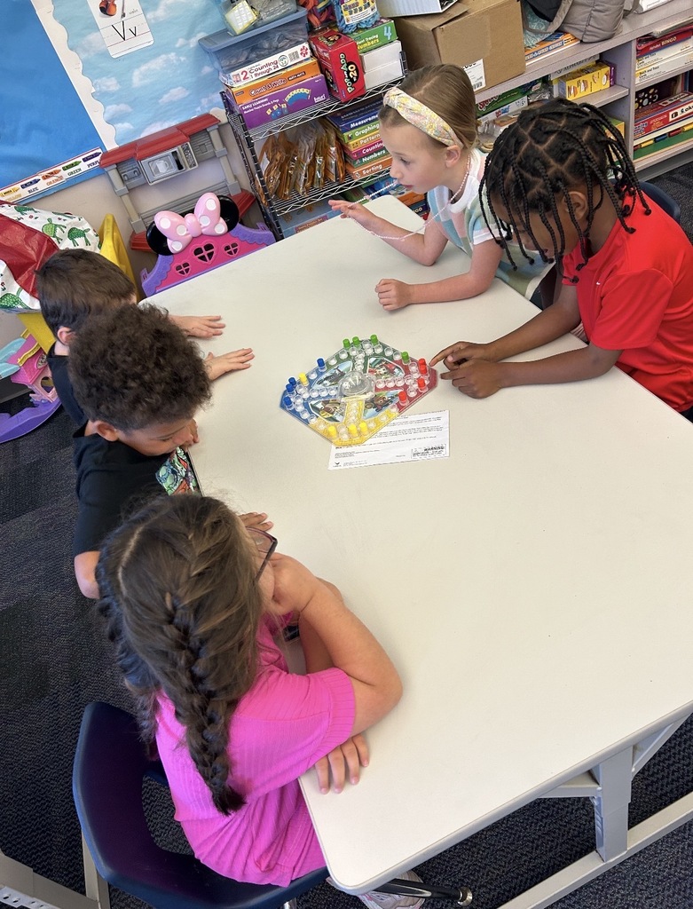 Kindergarten students playing board games 