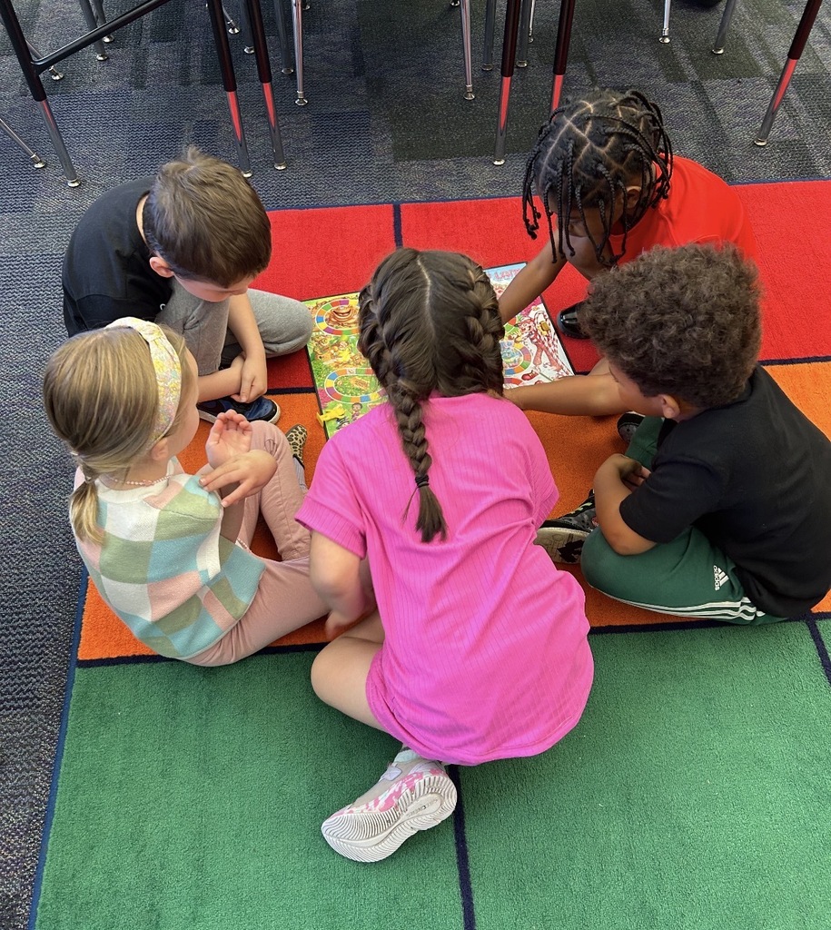 Kindergarten students playing board games 