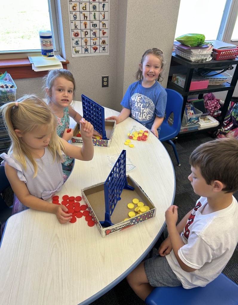 Kindergarten students playing board games 
