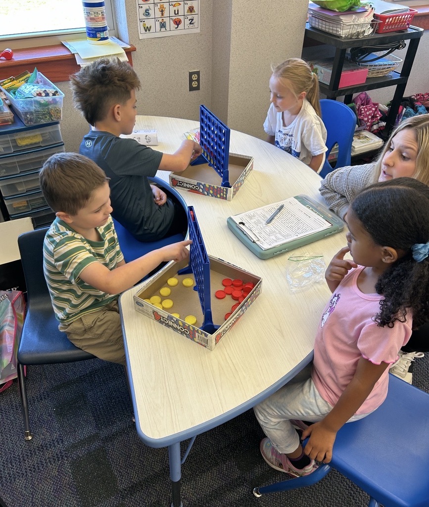 Kindergarten students playing board games 