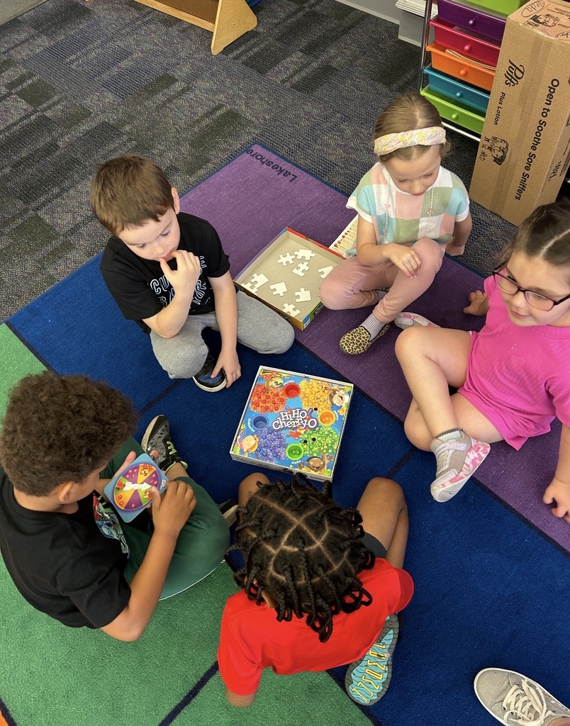 Kindergarten students playing board games 