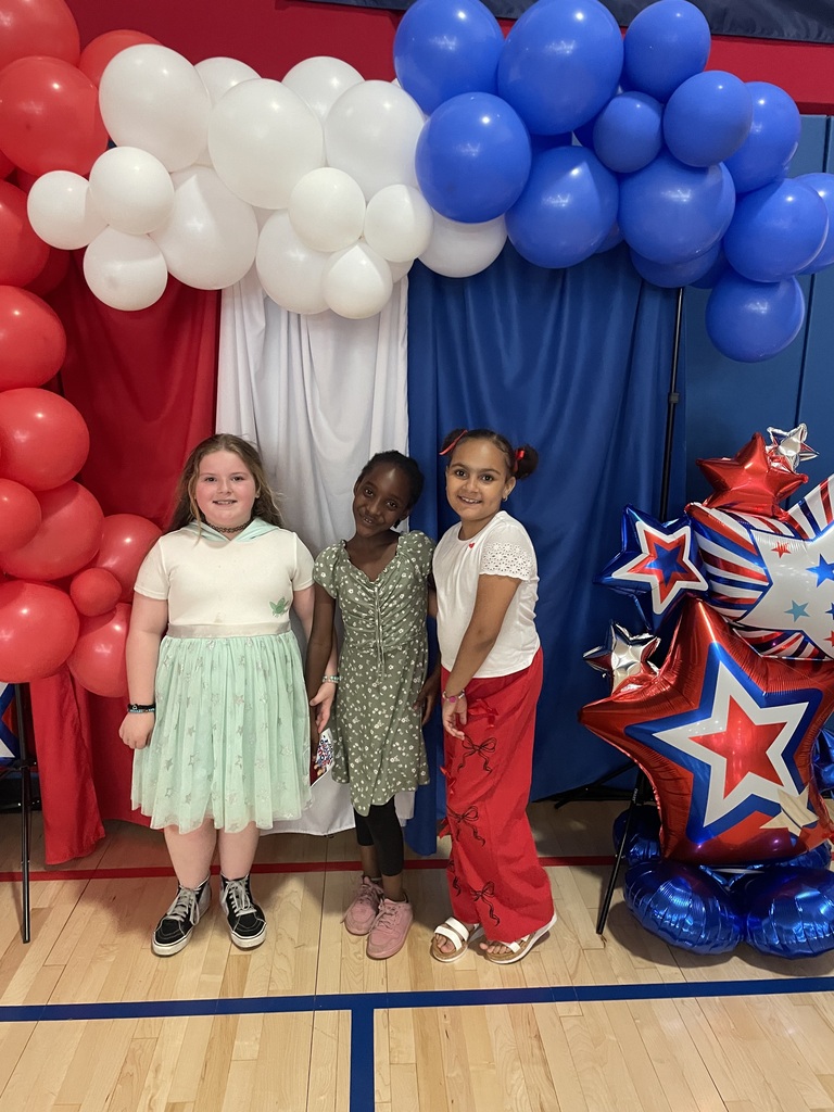 2nd grade students in the gym at a peace out second grade party