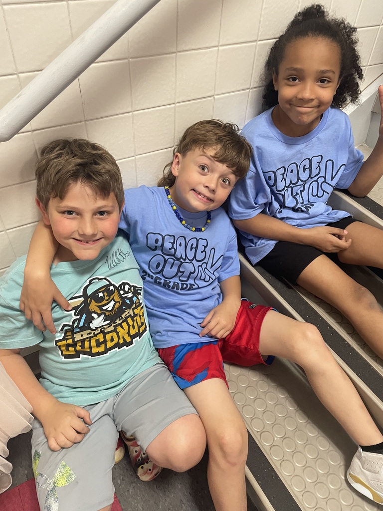 2nd grade students in the gym at a peace out second grade party