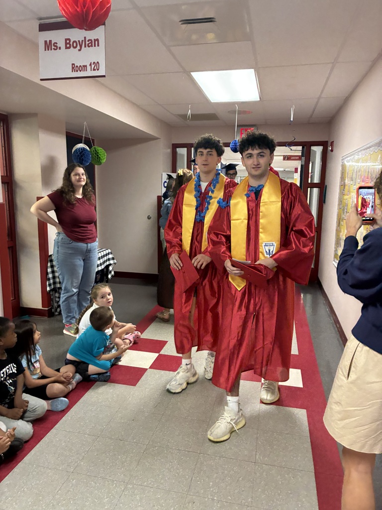 High schools students in the primary center hallways greeted by students and teachers  