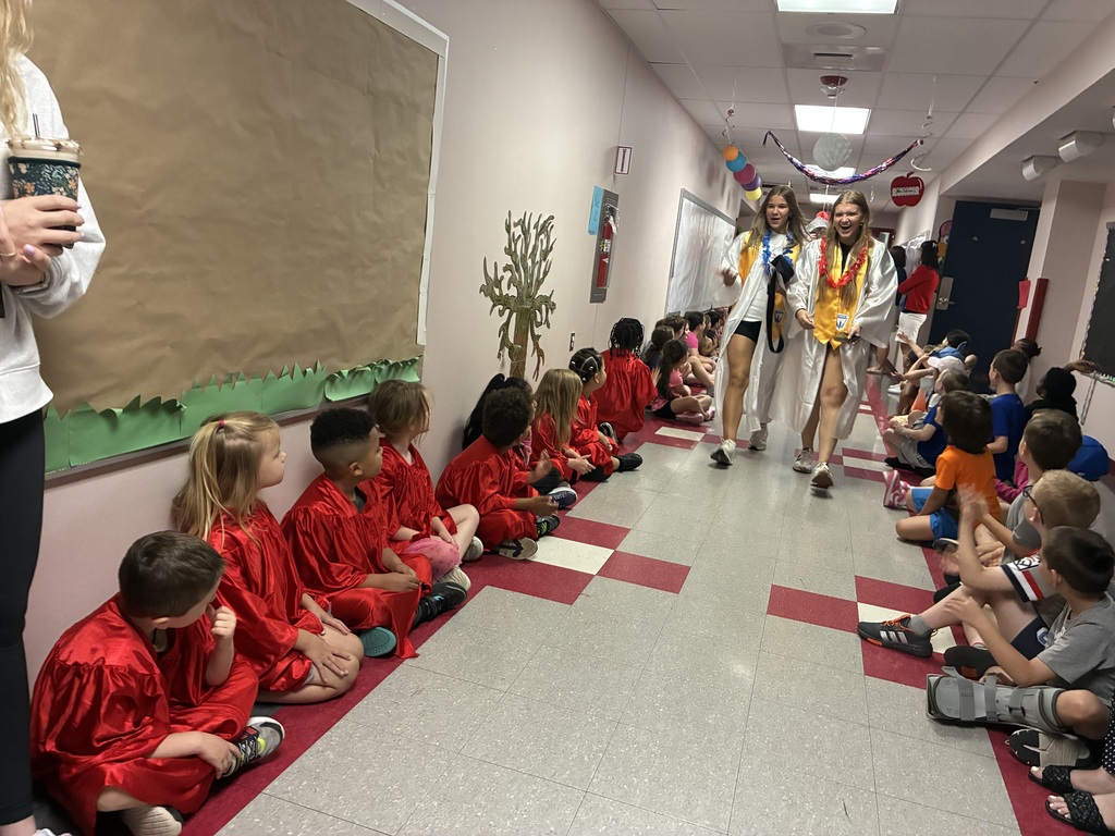 High schools students in the primary center hallways greeted by students and teachers  