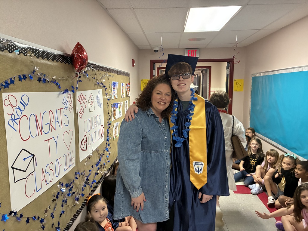 High schools students in the primary center hallways greeted by students and teachers  