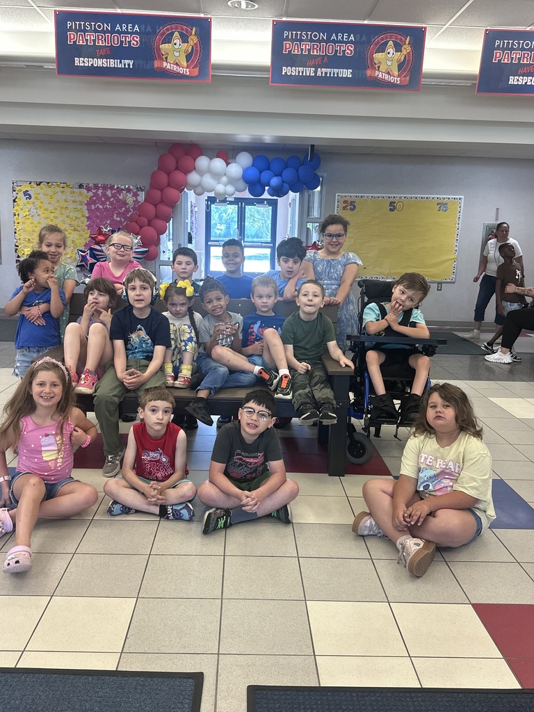 Students in front of a buddy bench