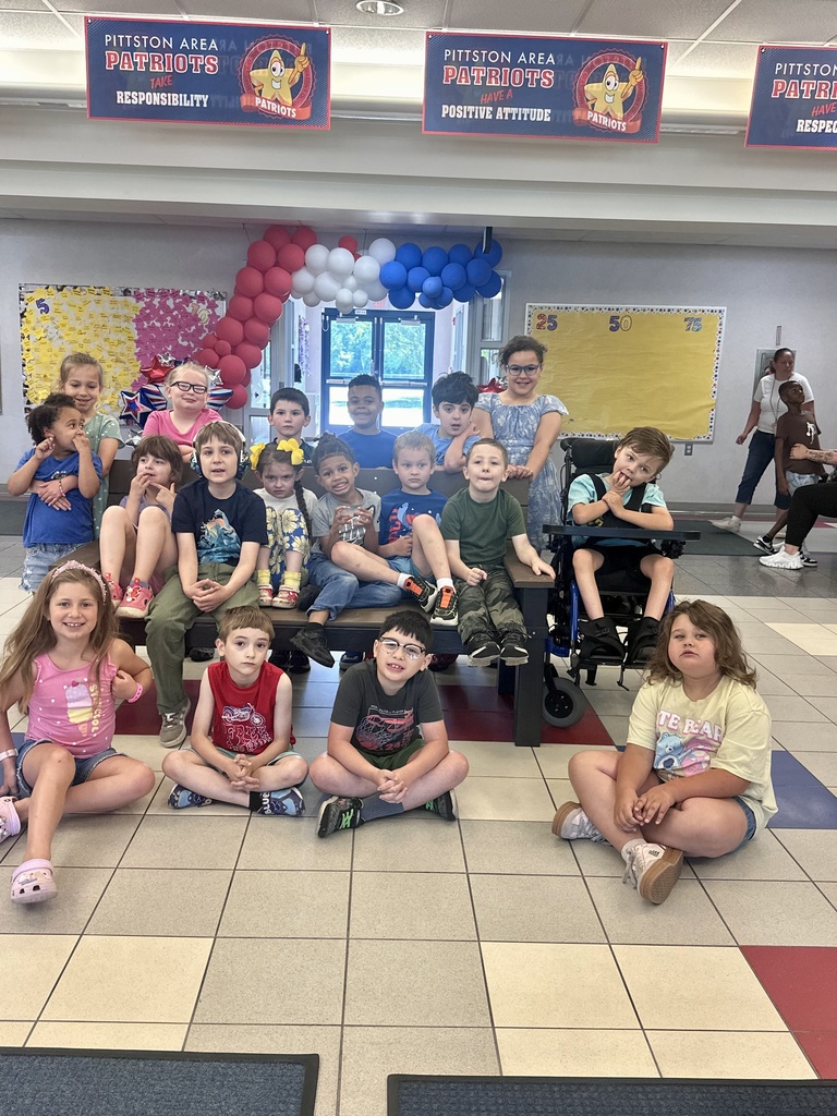 Students in front of a buddy bench