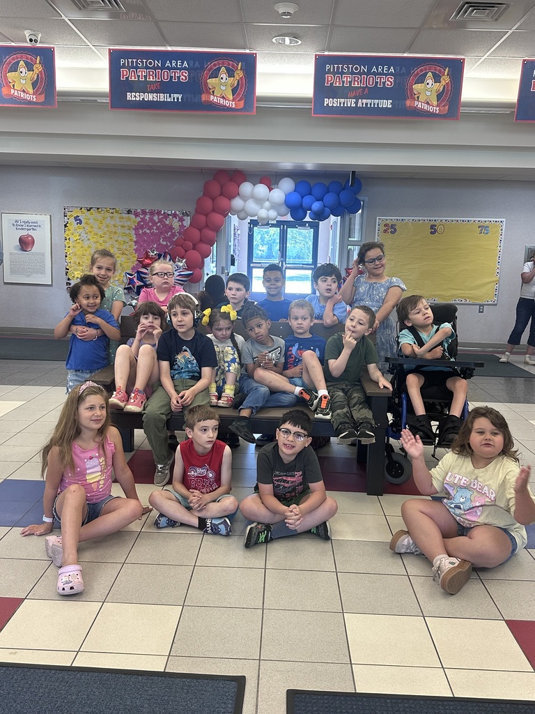 Students in front of a buddy bench