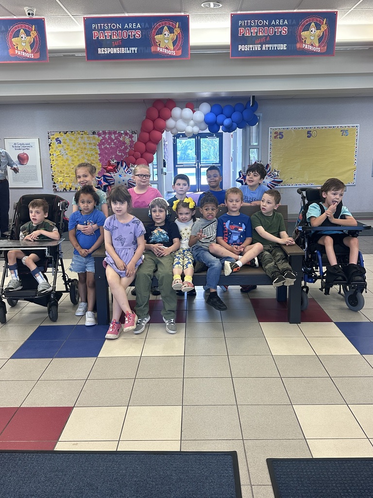 Students in front of a buddy bench