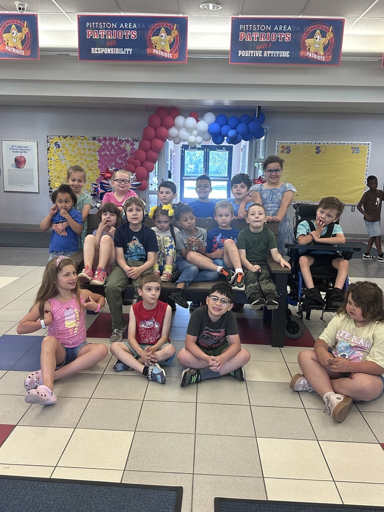 Students in front of a buddy bench