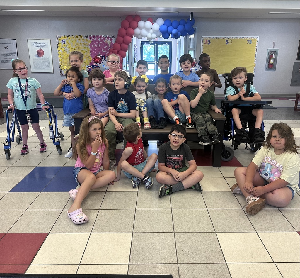 Students in front of a buddy bench