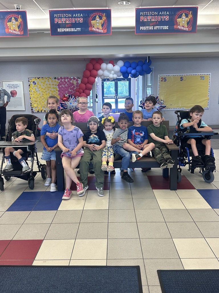 Students in front of a buddy bench