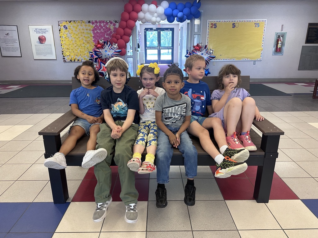 Students in front of a buddy bench
