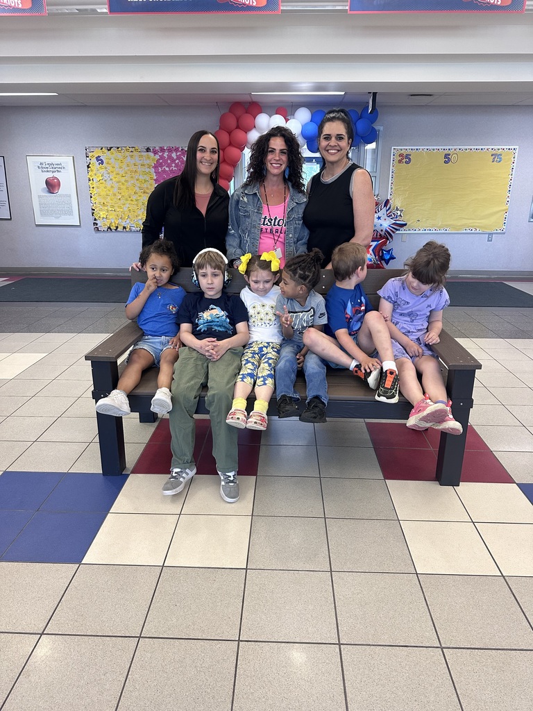 Students in front of a buddy bench