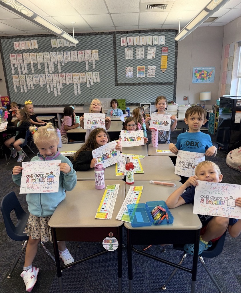 Students with class family posters