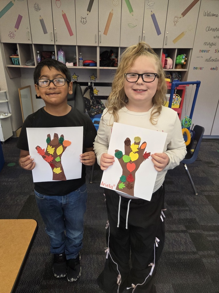 Students with a fall tree collage