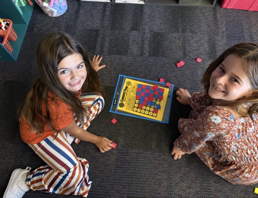Students playing connect four with reading words