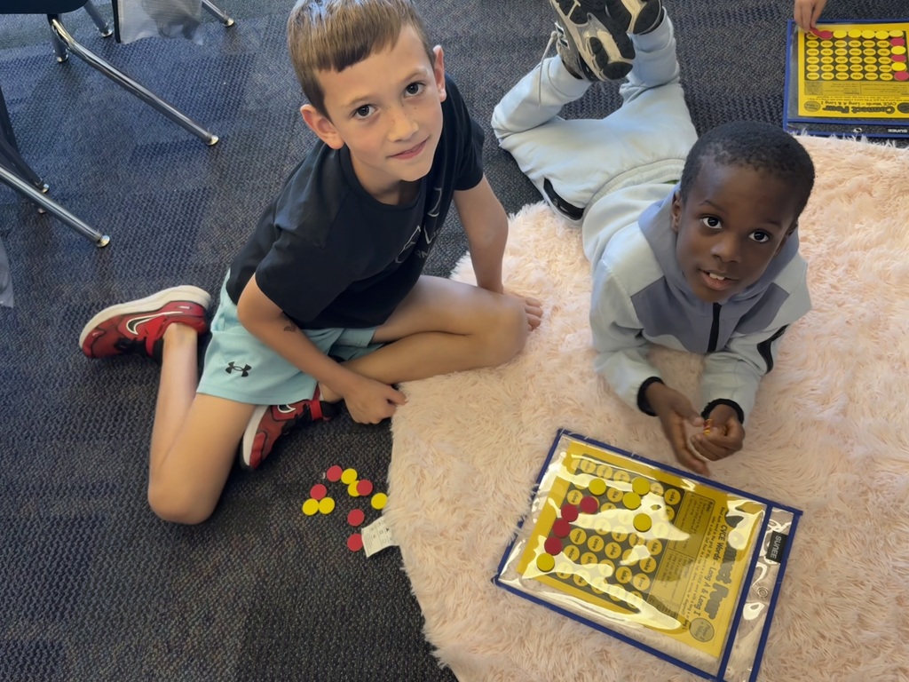 Students playing connect four with reading words