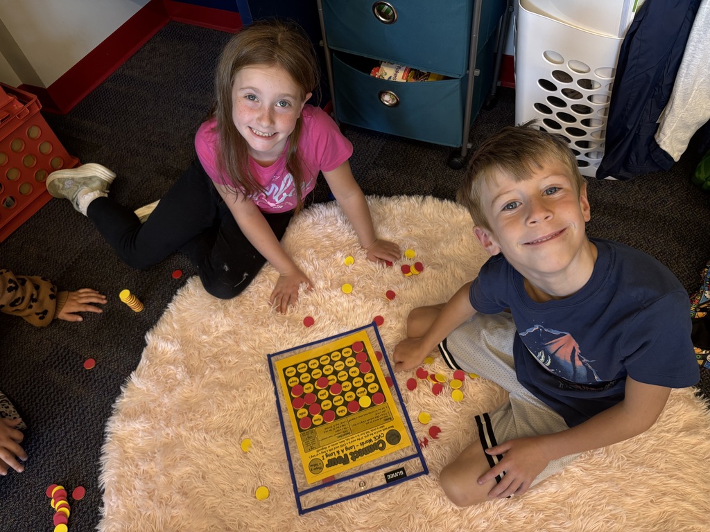 Students playing connect four with reading words