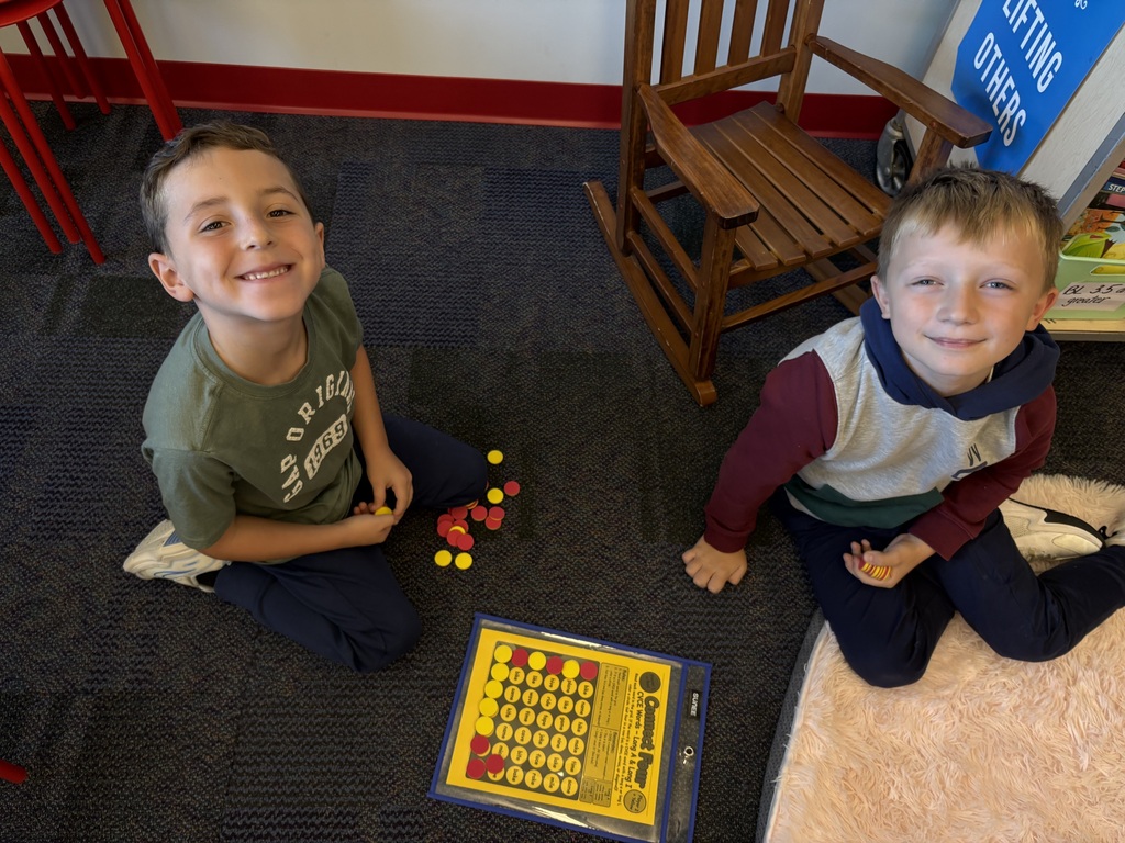Students playing connect four with reading words