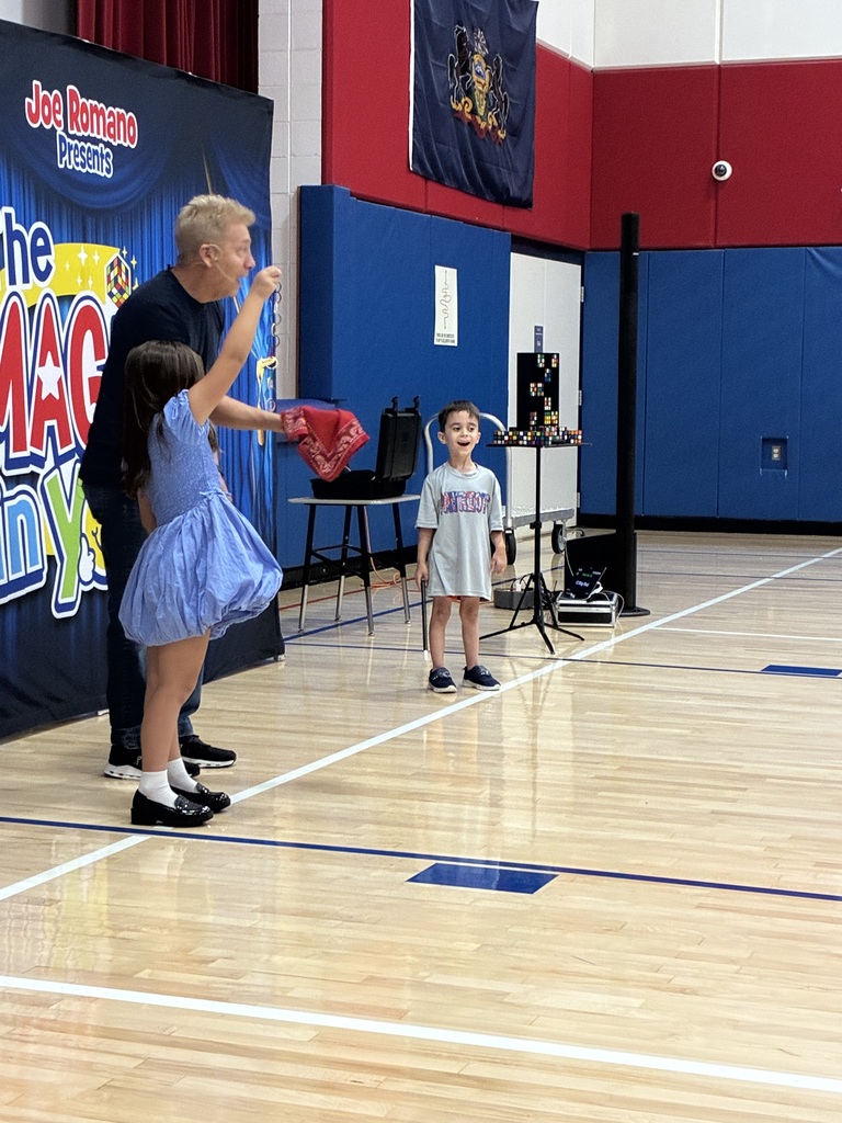 Students at a magic show assembly