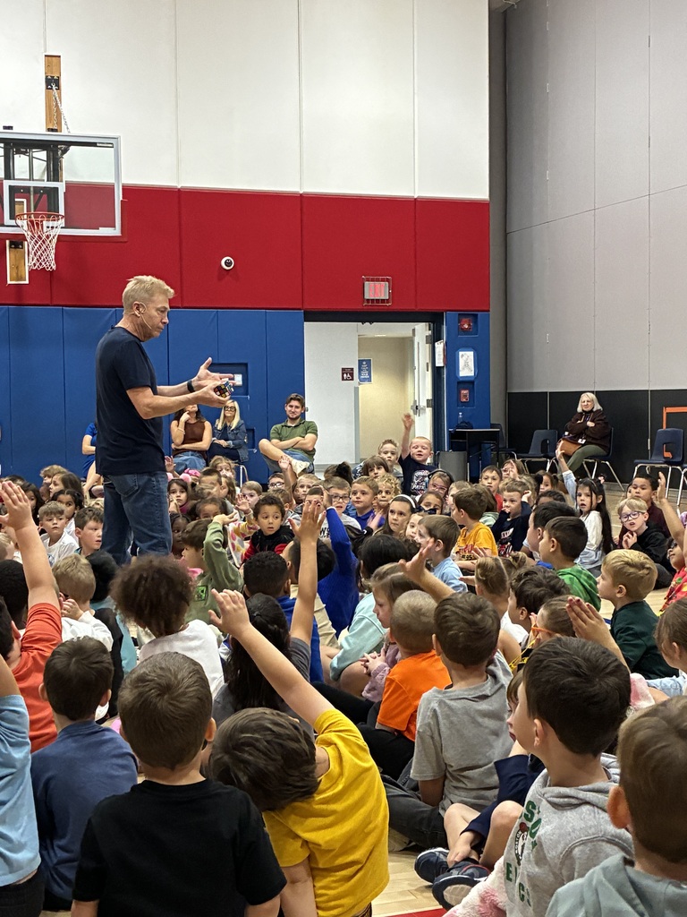 Students at a magic show assembly