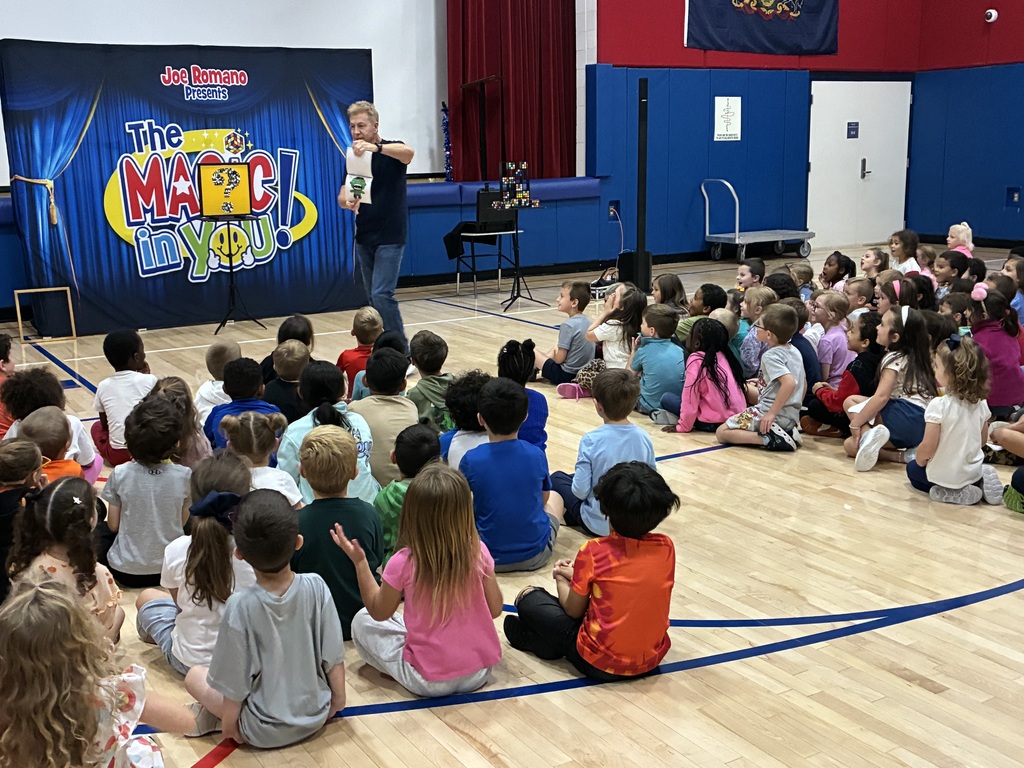 Students at a magic show assembly