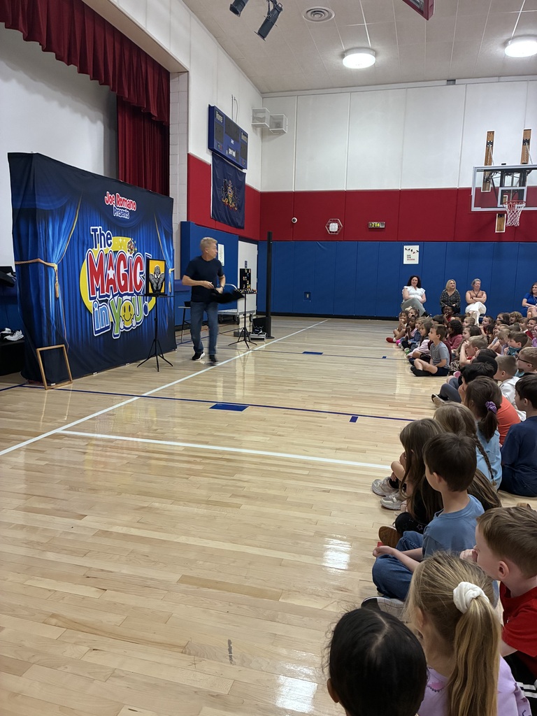 Students at a magic show assembly