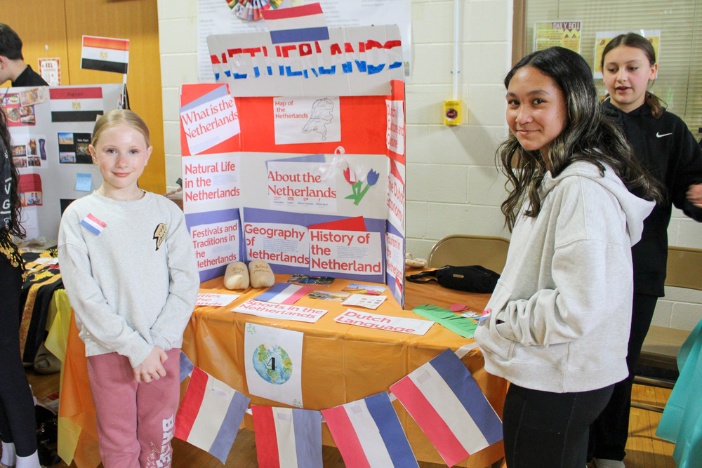 students at booth at 2025 JFK Multicultural Fair 