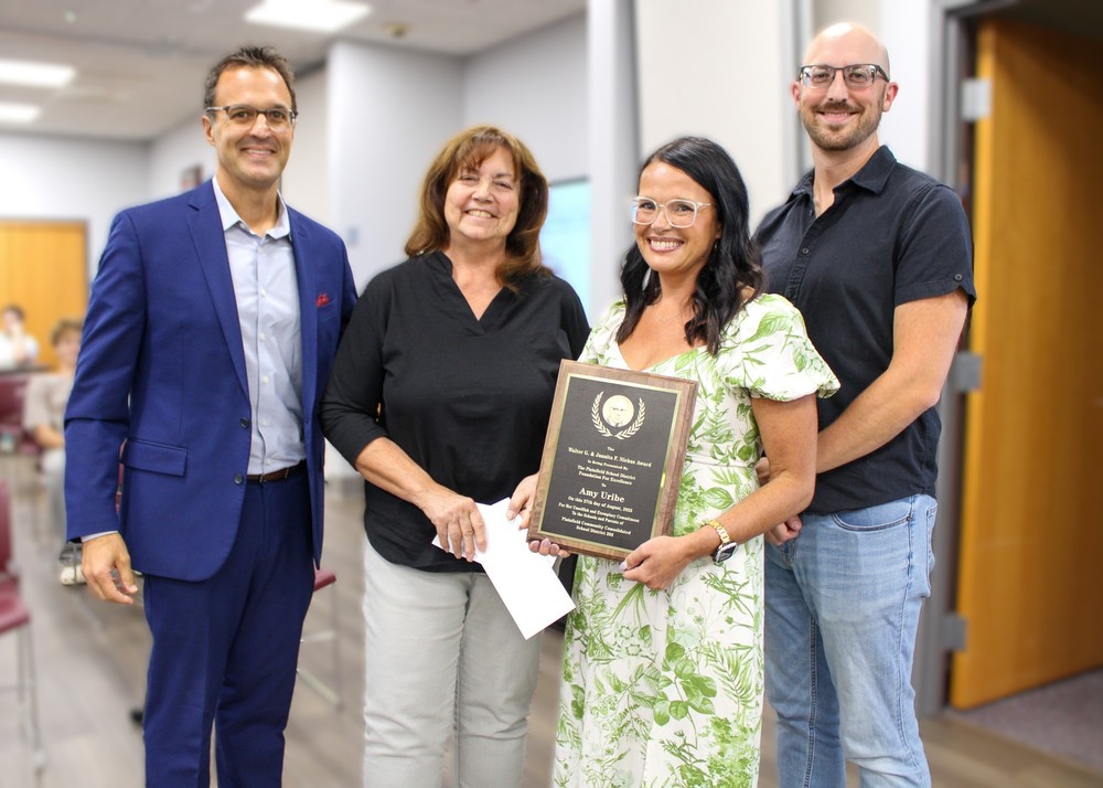 Amy Uribe (second from right) is pictured with Board of Education secretary and Plainfield School District Foundation for Excellence Board liaison Elias Kalantzis (from left), Plainfield School District Foundation for Excellence chair Margie Bonuchi and vice chair Matthew Starr.