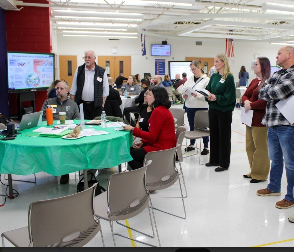 community members listening at strategic planning meeting 