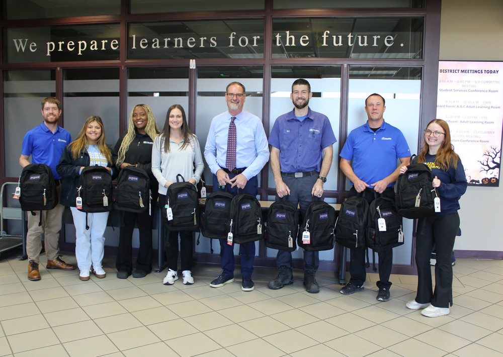 TR miller donates backpacks