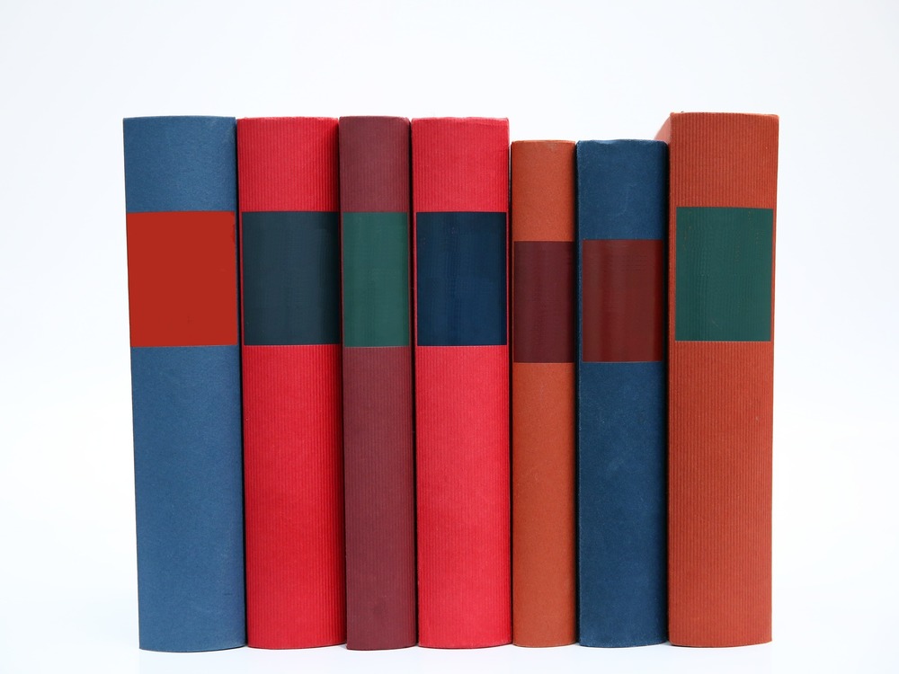 colorful books lined up in row vertically