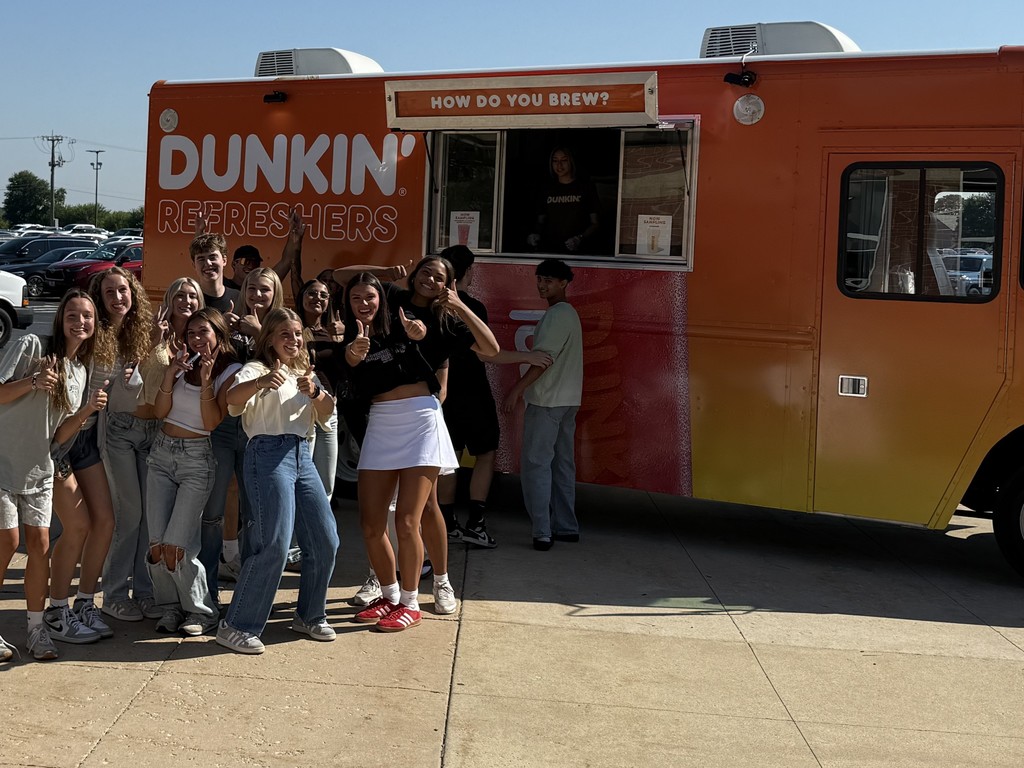 students standing at dunkin truck on first day of school